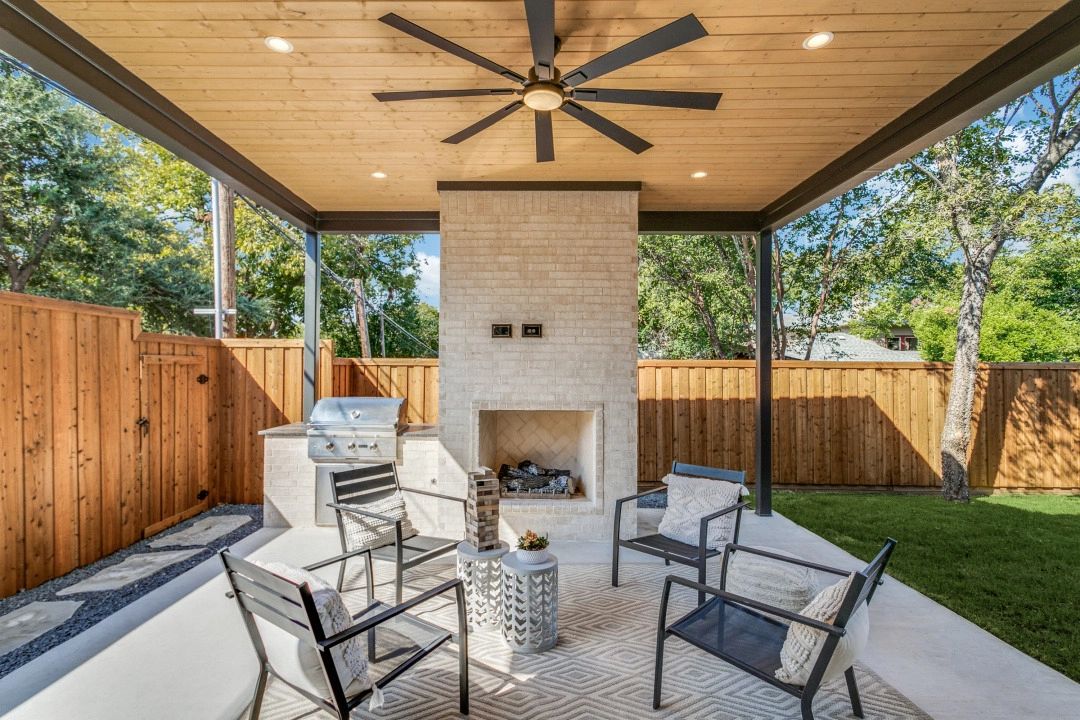 Covered patio with fireplace — Select Custom Home
